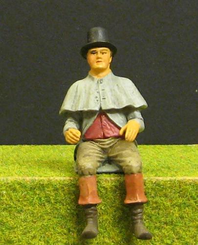 77134_Sitzende_Kutscher_mit Regenumhang_(O).jpg